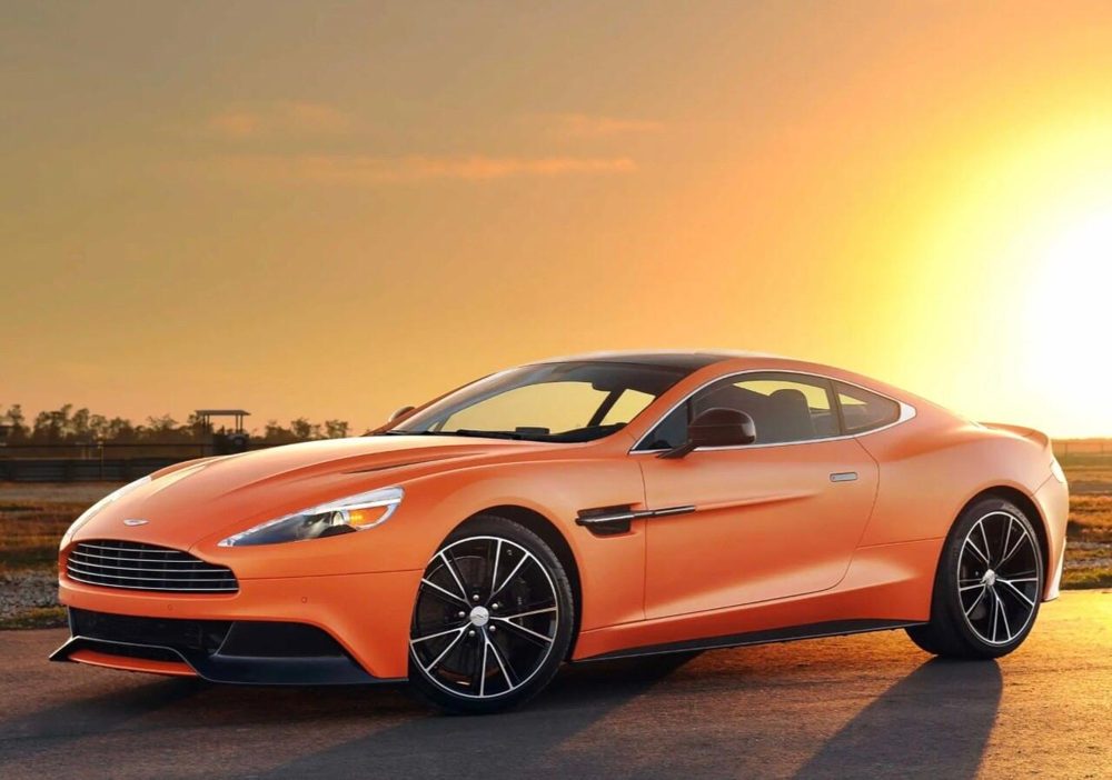 Orange sports car at sunset