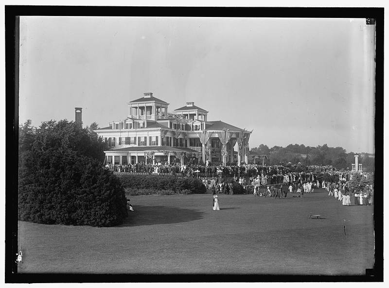 Crowds on the lawn of the original Shadow Lawn mansion, draped in flags, during Woodrow Wilson’s 1916 notification ceremonies