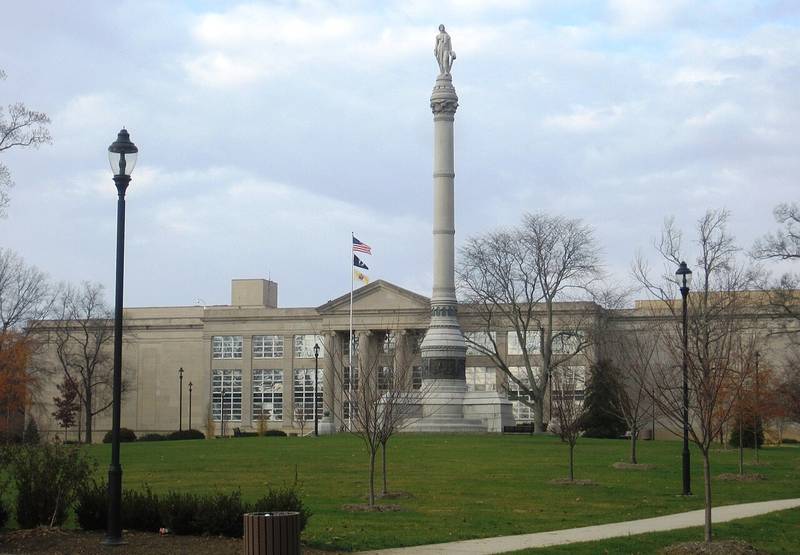 The tall Monmouth Battle Monument column in front of the Monmouth County Courthouse