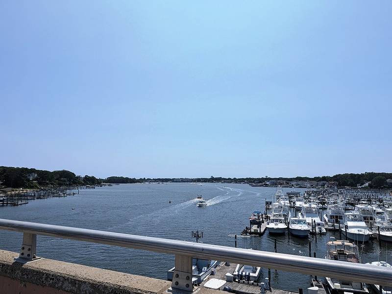 The Manasquan River and a marina seen from the Route 70 bridge, with Point Pleasant on the right
