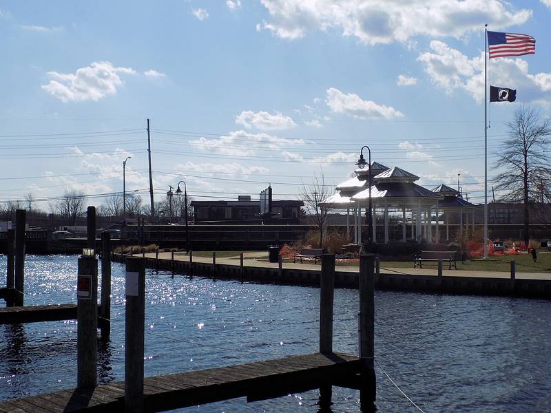Boat docks on the Toms River at Huddy Park in downtown Toms River, with the park gazebos behind